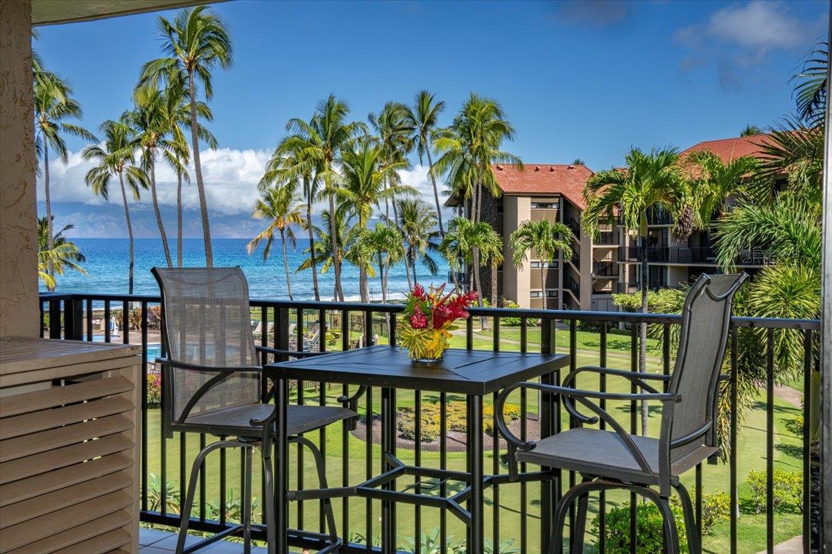 3543 Lower Honoapiilani Road, Unit J302 Lahaina, HI 96761 - Photo 1 of 44 a view of a chairs and table in patio