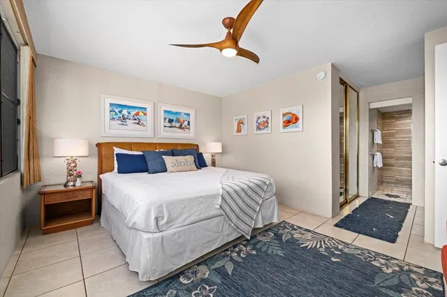 a bathroom with a double vanity sink toilet and shower