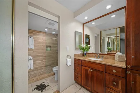 a bathroom with a toilet and shower