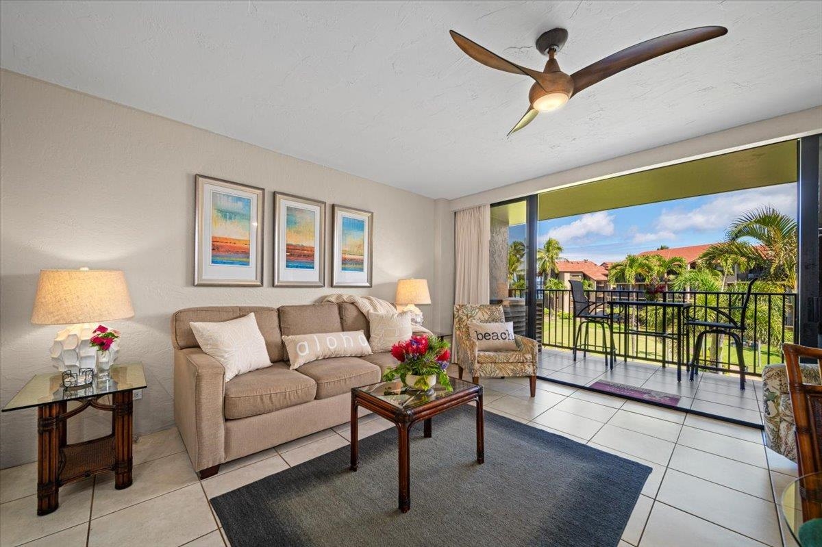 3543 Lower Honoapiilani Road, Unit J302 Lahaina, HI 96761 - Photo 15 of 44 a living room with furniture and a flat screen tv