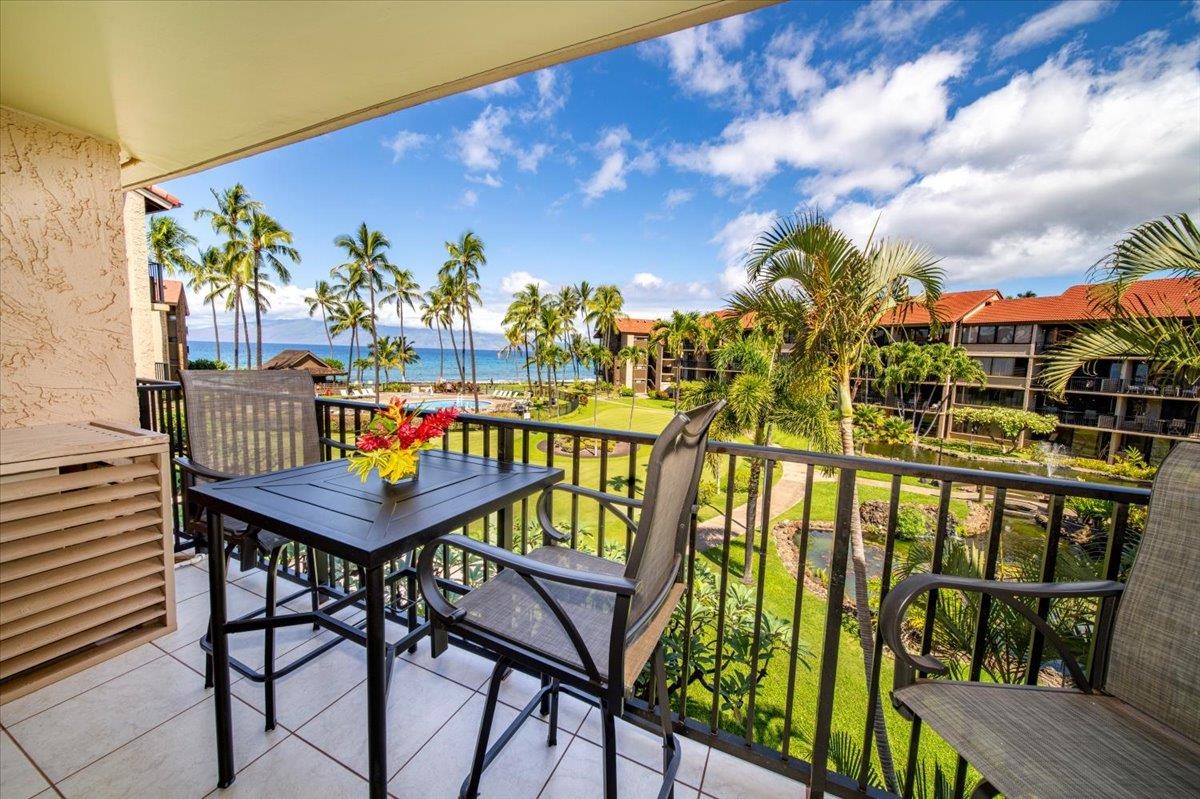 3543 Lower Honoapiilani Road, Unit J302 Lahaina, HI 96761 - Photo 19 of 44 a view of a chairs and table in patio