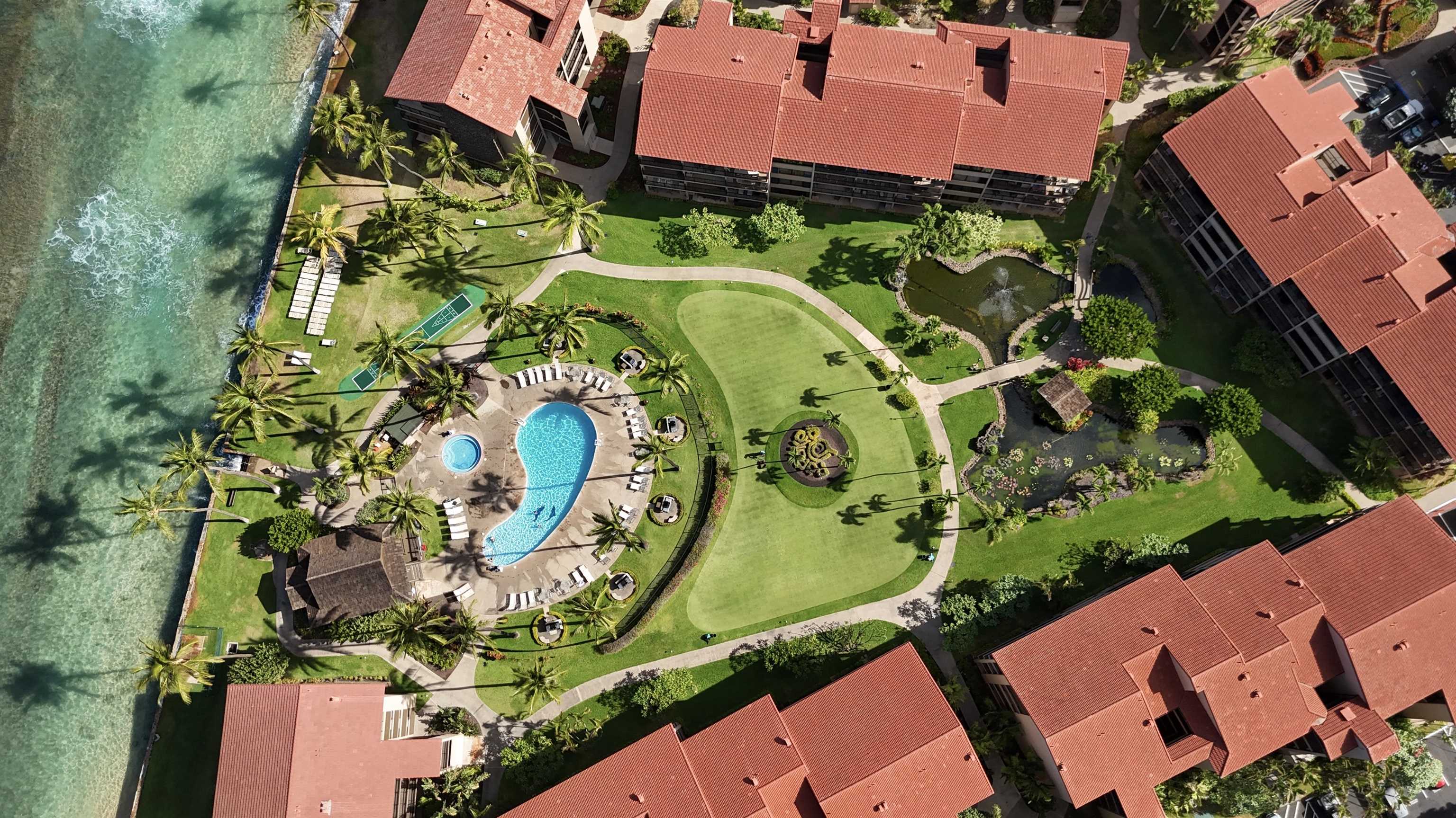 3543 Lower Honoapiilani Road, Unit J302 Lahaina, HI 96761 - Photo 21 of 44 an aerial view of a swimming pool