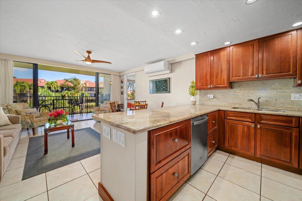 3543 Lower Honoapiilani Road, Unit J302 Lahaina, HI 96761 - Photo 23 of 44 a kitchen with a sink and cabinets