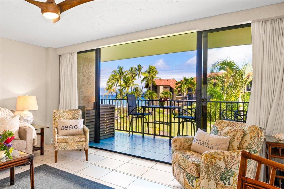 3543 Lower Honoapiilani Road, Unit J302 Lahaina, HI 96761 - Photo 4 of 44 a living room with furniture and a large window