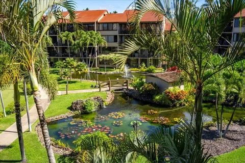 an aerial view of a house with outdoor space
