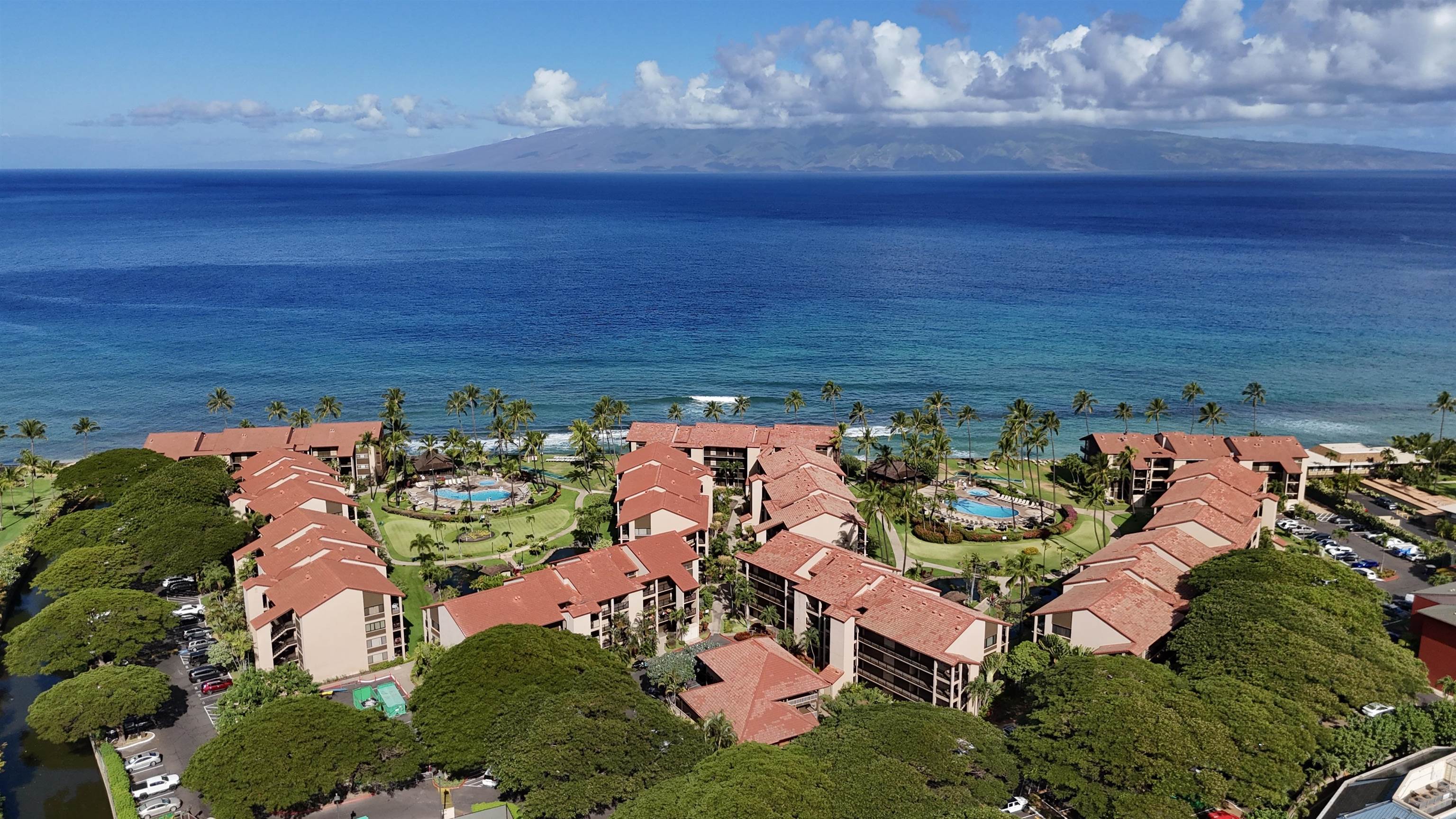 3543 Lower Honoapiilani Road, Unit J302 Lahaina, HI 96761 - Photo 6 of 44 a view of swimming pool outdoor seating and water