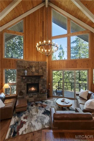 a kitchen with stainless steel appliances granite countertop a sink a counter space and wooden cabinets