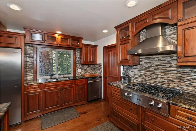 a bed sitting in a room next to a window