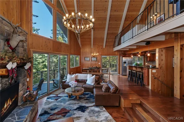 a kitchen with stainless steel appliances granite countertop a sink a counter space and wooden cabinets