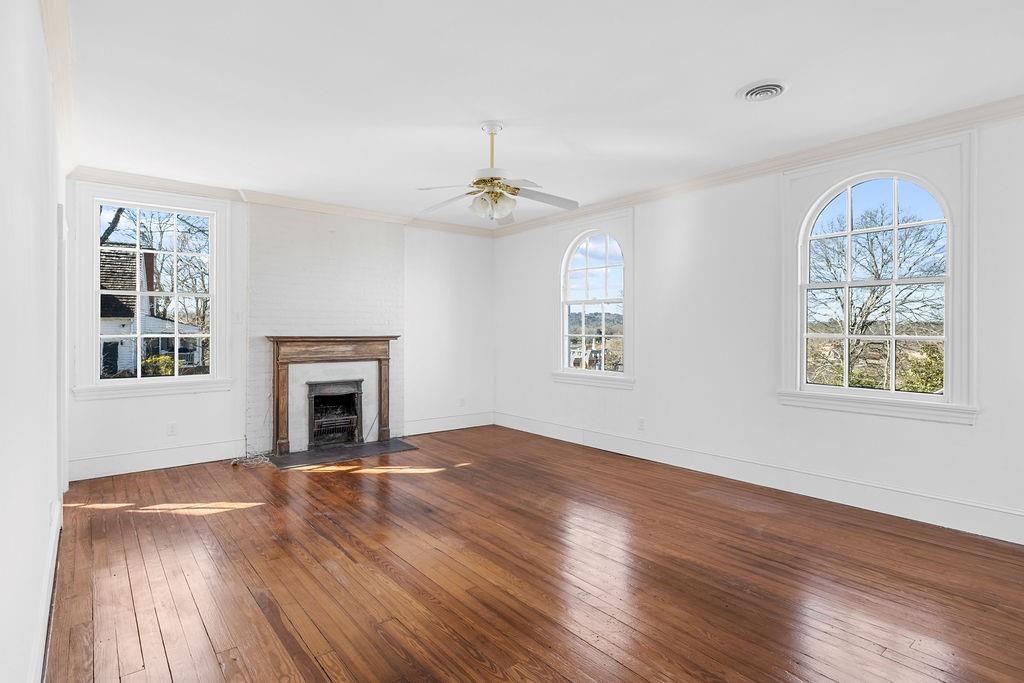 312 East 3rd Street Rome, GA 30161 - Photo 34 of 42 a view of empty room with wooden floor and fan