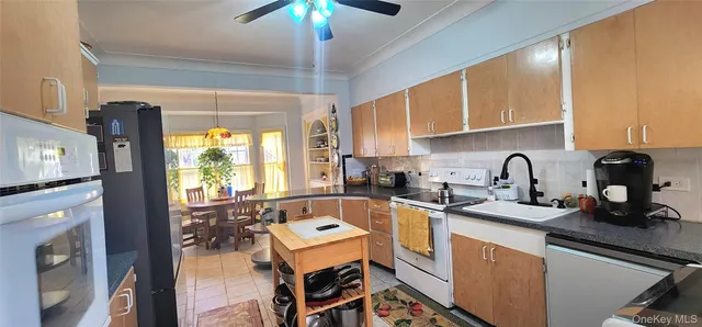 a kitchen with a stove a sink and a microwave