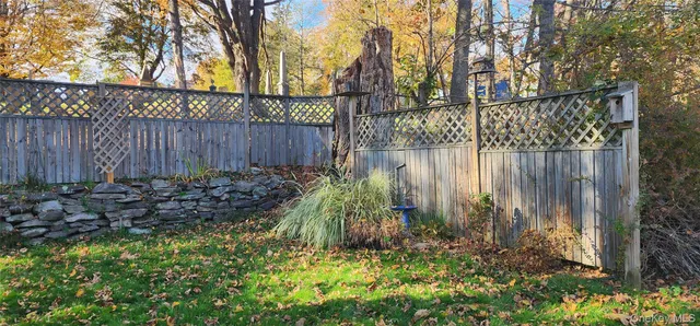a garden covered with wooden fence