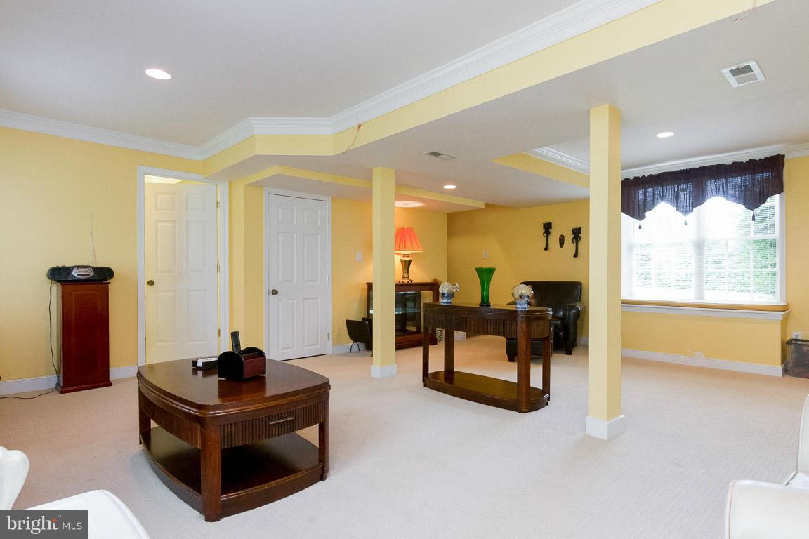 18310 Cattail Road Poolesville, MD 20837 - Photo 15 of 24 a living room with furniture and a large window