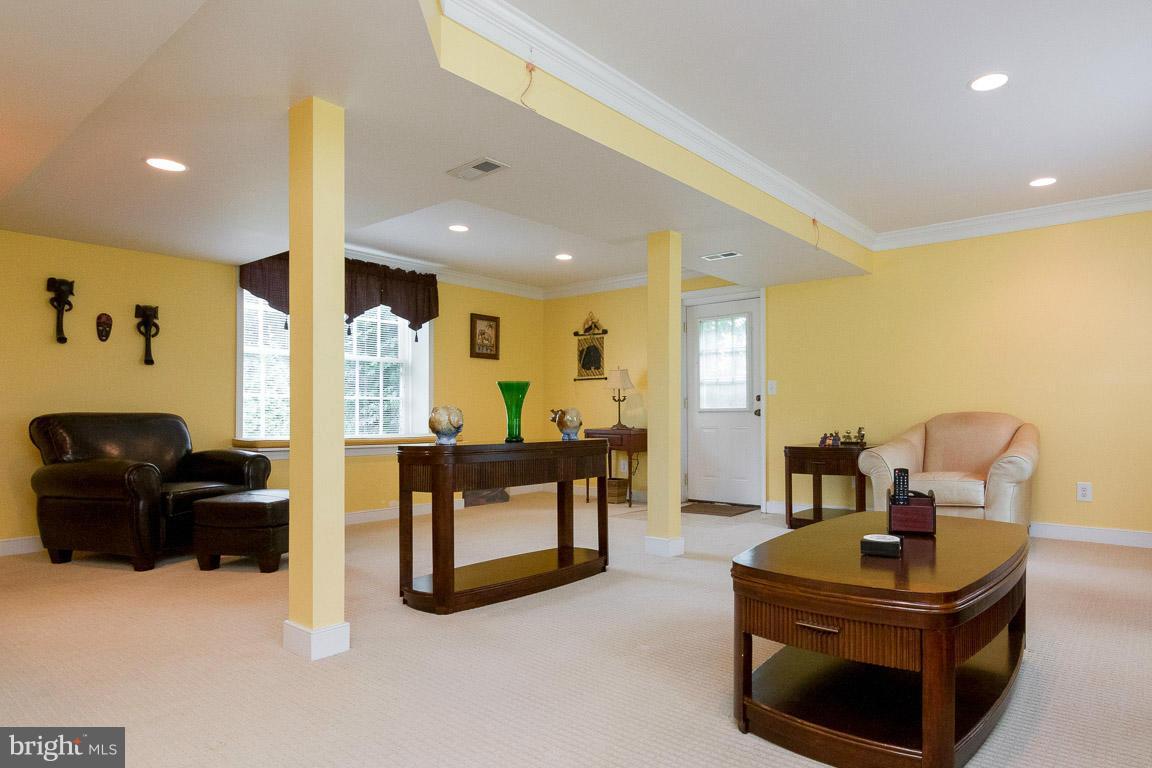 18310 Cattail Road Poolesville, MD 20837 - Photo 16 of 24 a living room with furniture and a table
