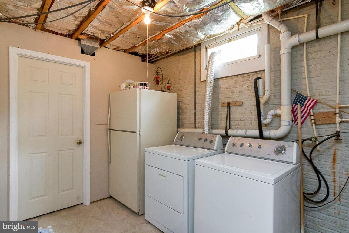 18310 Cattail Road Poolesville, MD 20837 - Photo 18 of 24 a utility room with dryer and washer