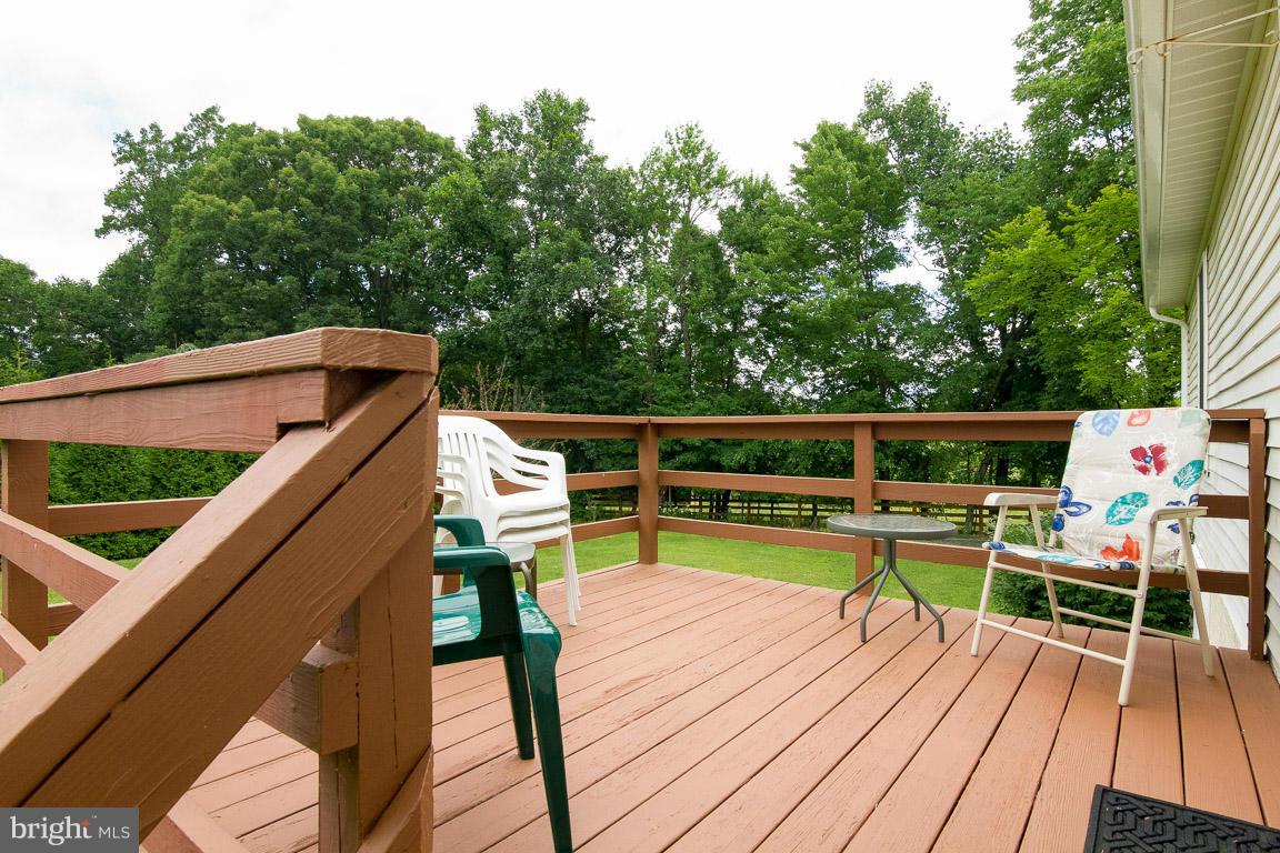 18310 Cattail Road Poolesville, MD 20837 - Photo 19 of 24 a view of deck with chairs and wooden floor