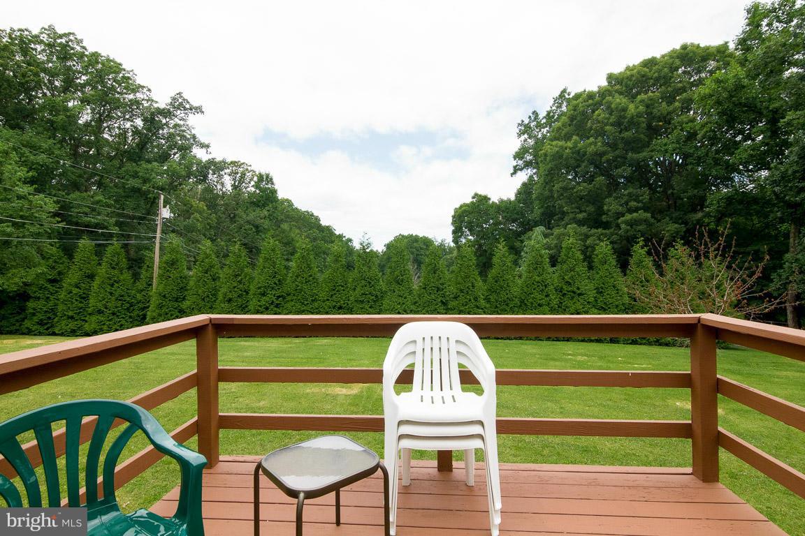 18310 Cattail Road Poolesville, MD 20837 - Photo 20 of 24 a view of outdoor chair and table in the balcony