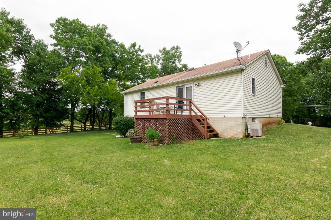 18310 Cattail Road Poolesville, MD 20837 - Photo 21 of 24 a view of a house with a backyard