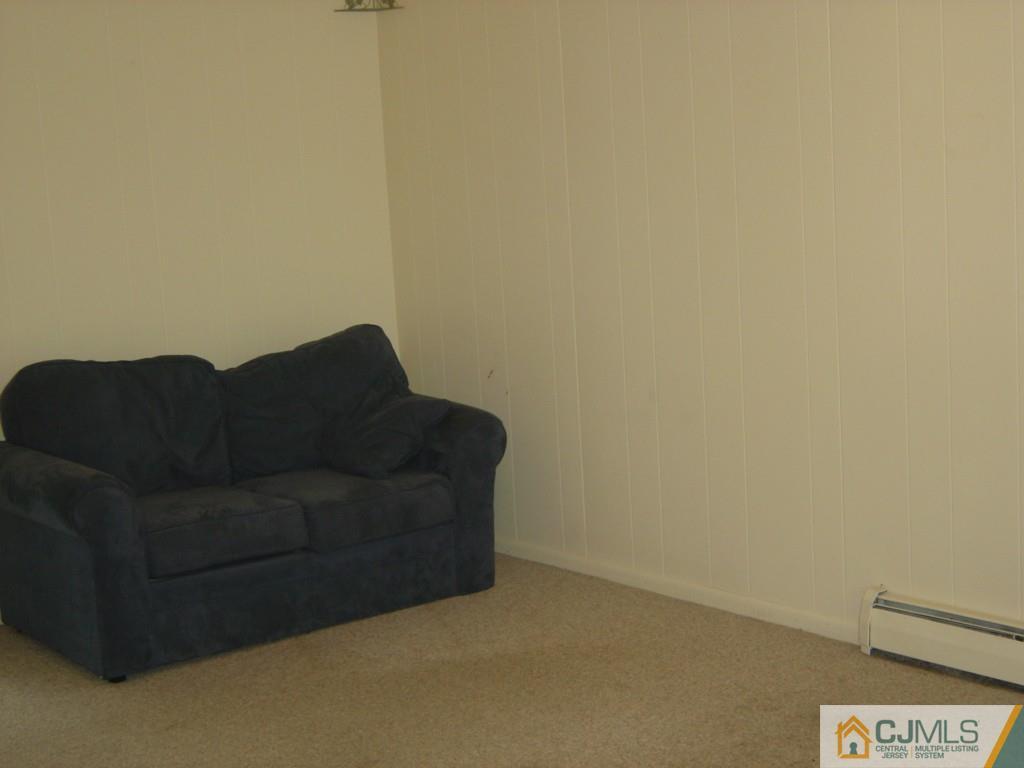 69 Greenbrook Road Middlesex, NJ 08846 - Photo 3 of 24 a living room with a couch