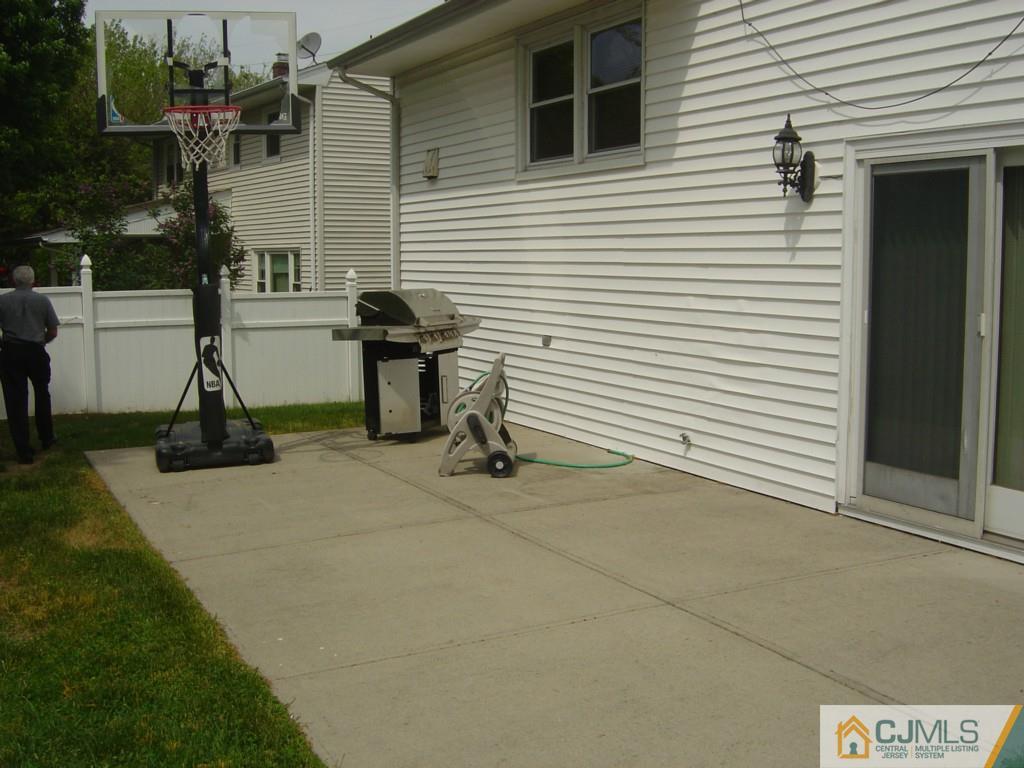 69 Greenbrook Road Middlesex, NJ 08846 - Photo 22 of 24 a view of a house with backyard and a tree