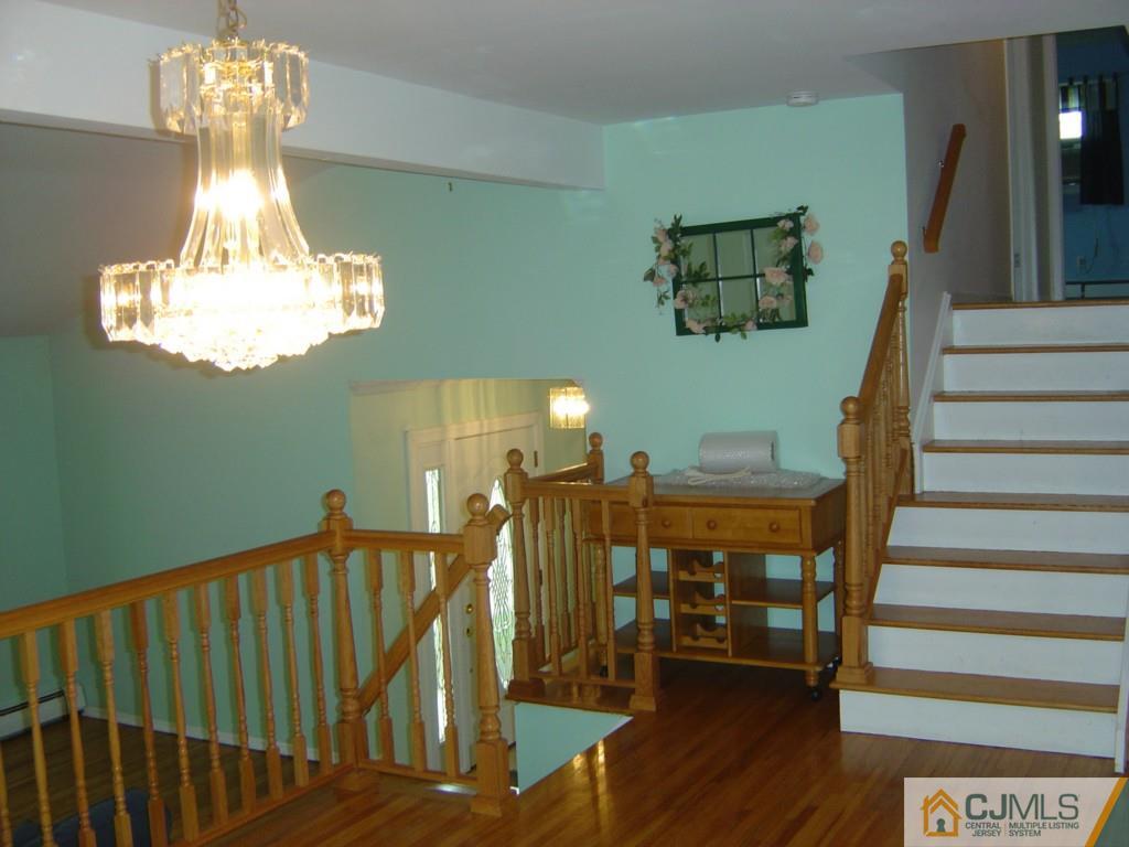69 Greenbrook Road Middlesex, NJ 08846 - Photo 8 of 24 a view of entryway and hall with wooden floor
