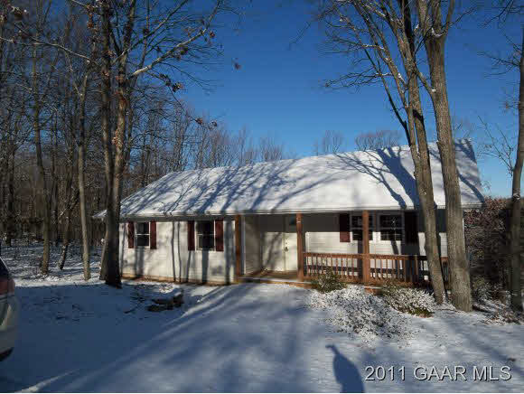 3453 Cold Springs Road Greenville, VA 24440 - Photo 1 of 7 a patio with a table and chairs under an umbrella