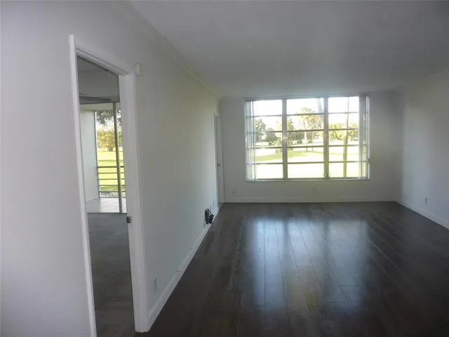a view of room with window and ceiling fan