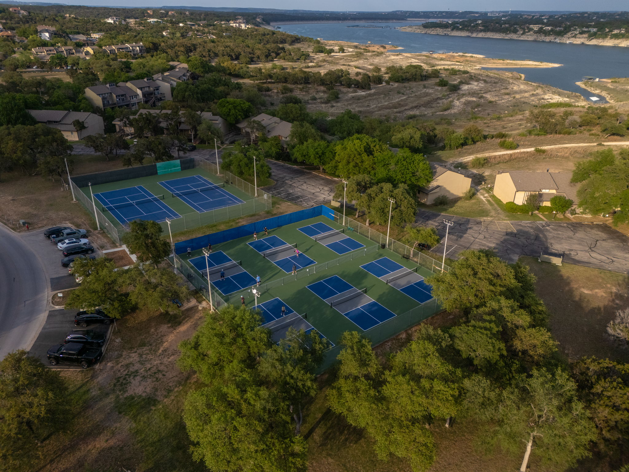 433 Venture Boulevard South Point Venture, TX 78645 - Photo 30 of 36 Pickleball, sunshine, and Hill Country views, because P.V. knows the good life needs a little friendly competition.
