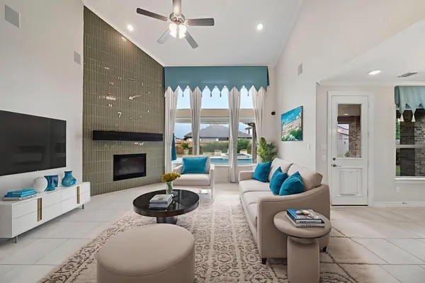 a view of a kitchen with a sink and a refrigerator