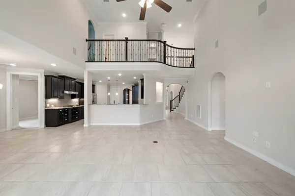 a view of a hallway with dining area and chandelier