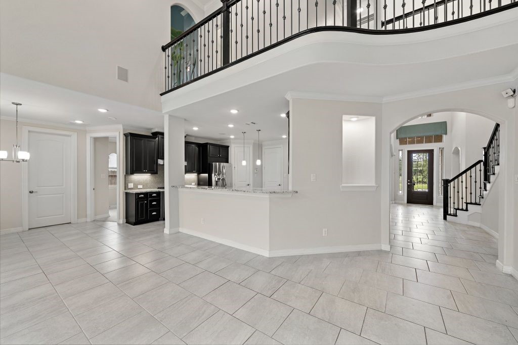 3810 Everly Bend Drive Spring, TX 77386 - Photo 14 of 40 a view of a hallway with dining area and chandelier