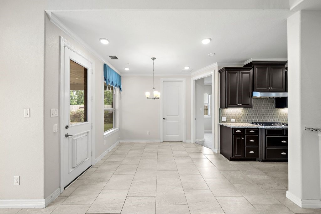 3810 Everly Bend Drive Spring, TX 77386 - Photo 18 of 40 a large kitchen with cabinets and stainless steel appliances
