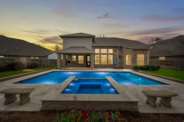 a view of swimming pool with lounge chair