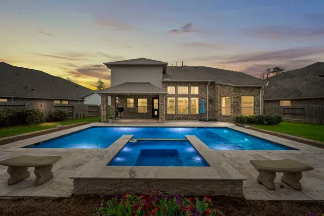 a view of swimming pool with lounge chair