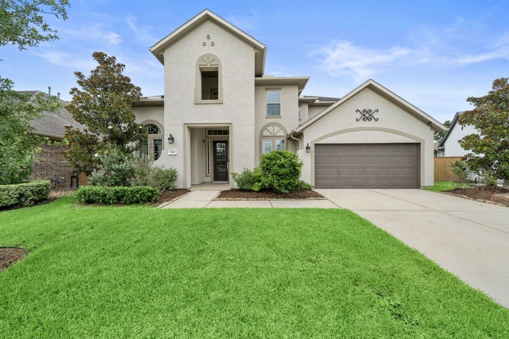 3810 Everly Bend Drive Spring, TX 77386 - Photo 3 of 40 a view of white house with a yard and large tree