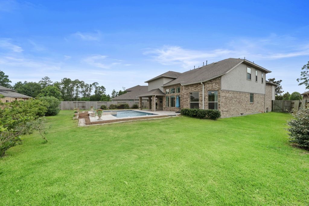 3810 Everly Bend Drive Spring, TX 77386 - Photo 35 of 40 a front view of a house with a garden