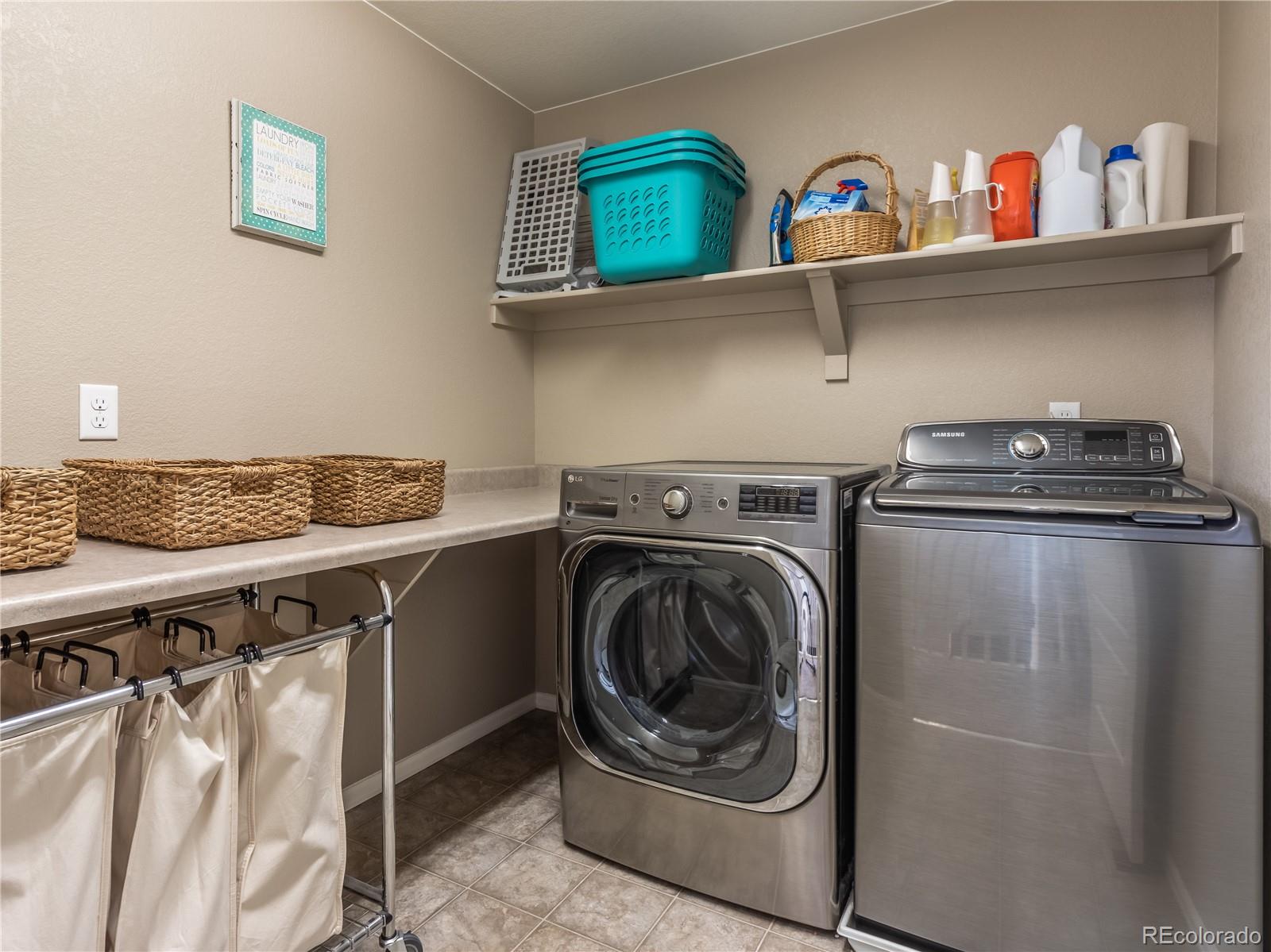 8639 Raspberry Drive Frederick, CO 80504 - Photo 23 of 30 a utility room with dryer and washer