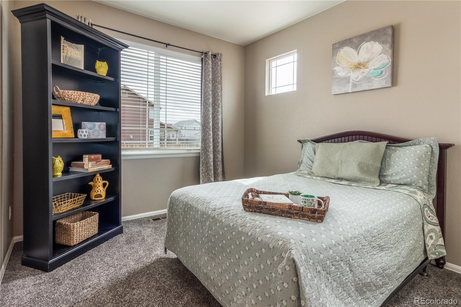 8639 Raspberry Drive Frederick, CO 80504 - Photo 7 of 30 a bedroom with a bed and window