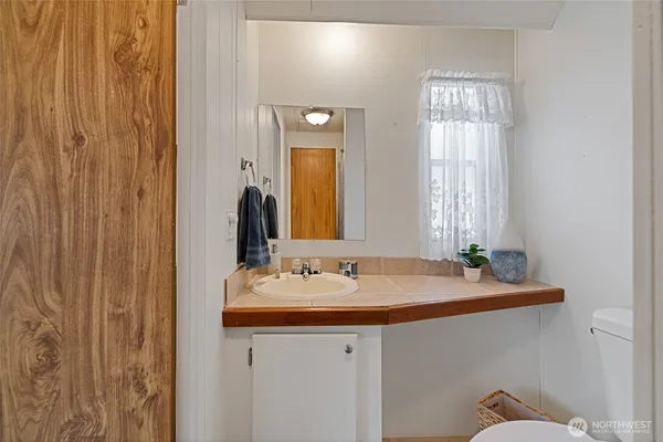 a bathroom with a sink and a mirror