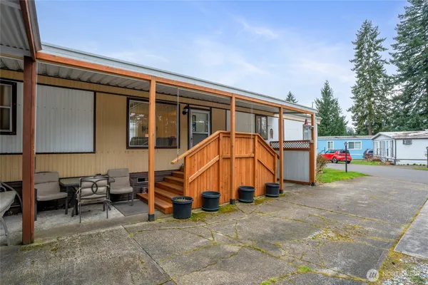 a view of a backyard with a small cabin