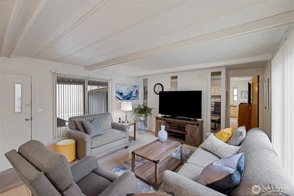 a living room with furniture and a large window