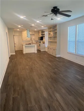 a view of kitchen with wooden floor and window