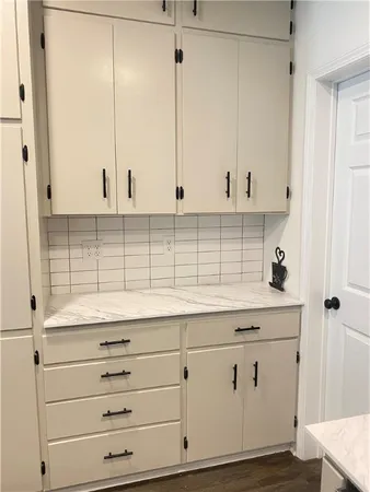 a view of cabinets with wooden floor