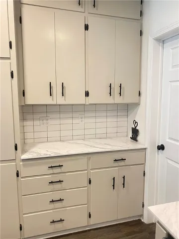 a view of cabinets with wooden floor