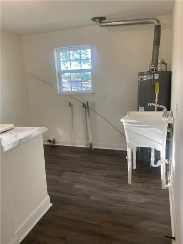 a workspace with furniture window and wooden floor