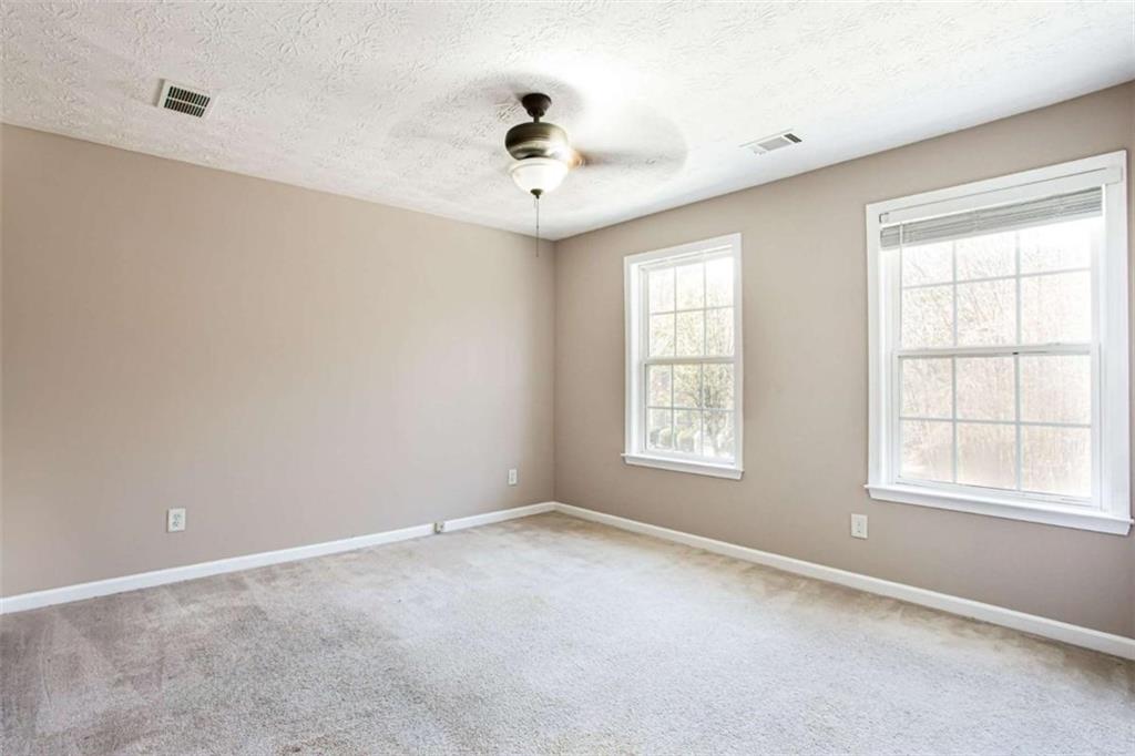 3721 Bogan Mill Road Northeast Buford, GA 30519 - Photo 28 of 58 a view of an empty room with a window