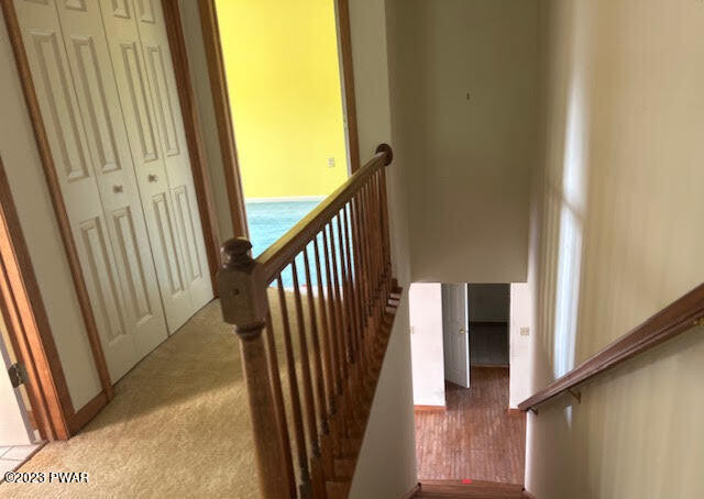 382 Roemerville Road Newfoundland, PA 18445 - Photo 15 of 25 a view of a hallway with wooden floor and stairs