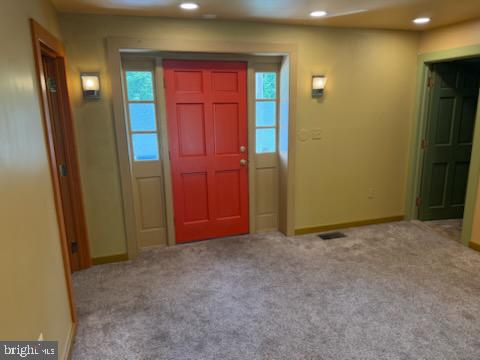 2212 Old Court Road, Unit 1 Pikesville, MD 21093 - Photo 8 of 8 Vibrant entryway with bold red door.
