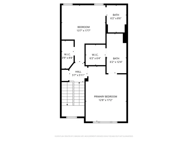 a picture of a bench in front of a wall