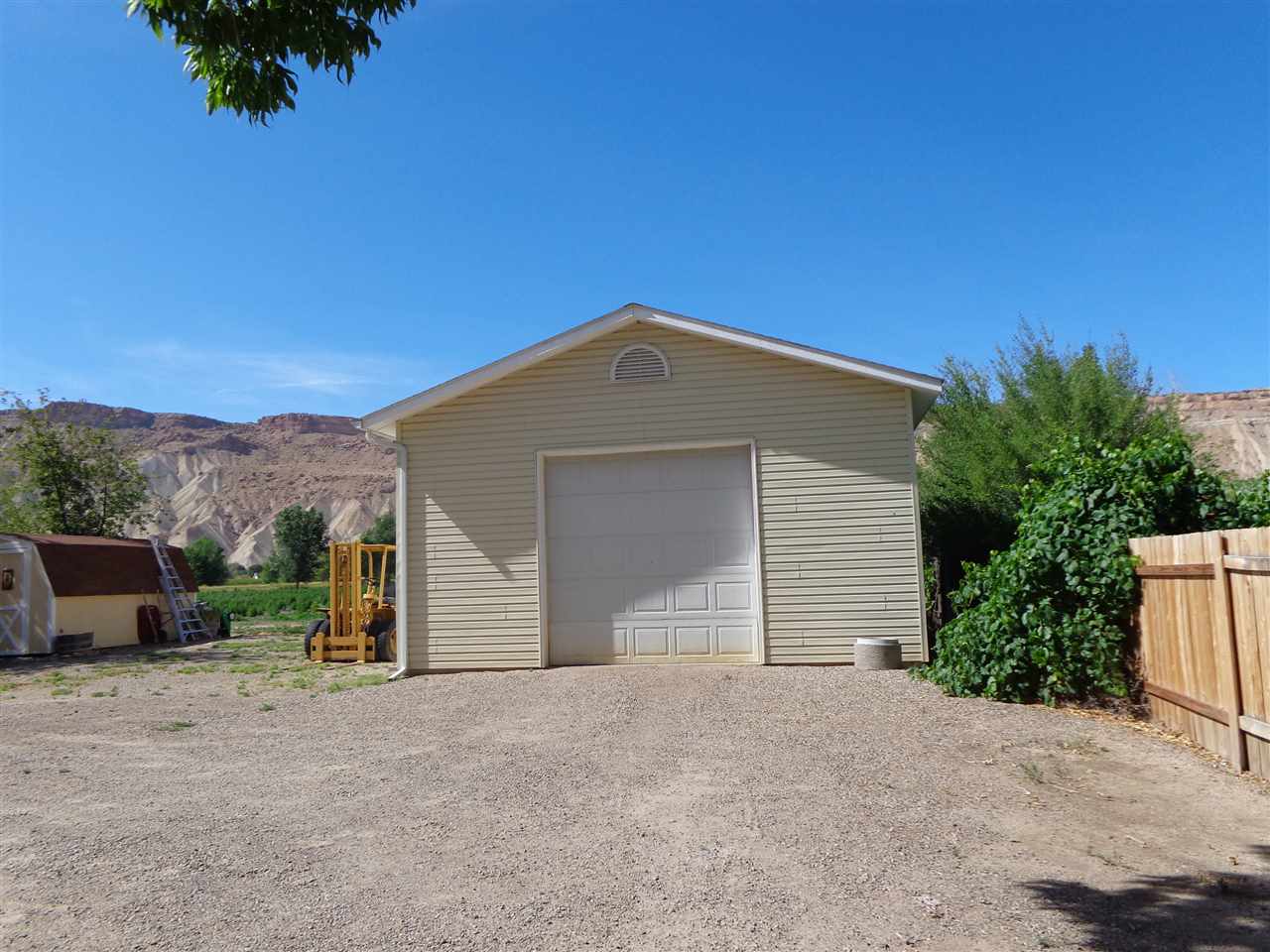 3628 G Road Palisade, CO 81526 - Photo 6 of 24 a front view of a house with a yard